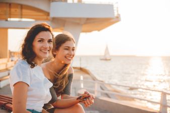 cheerful mother with teen daughter