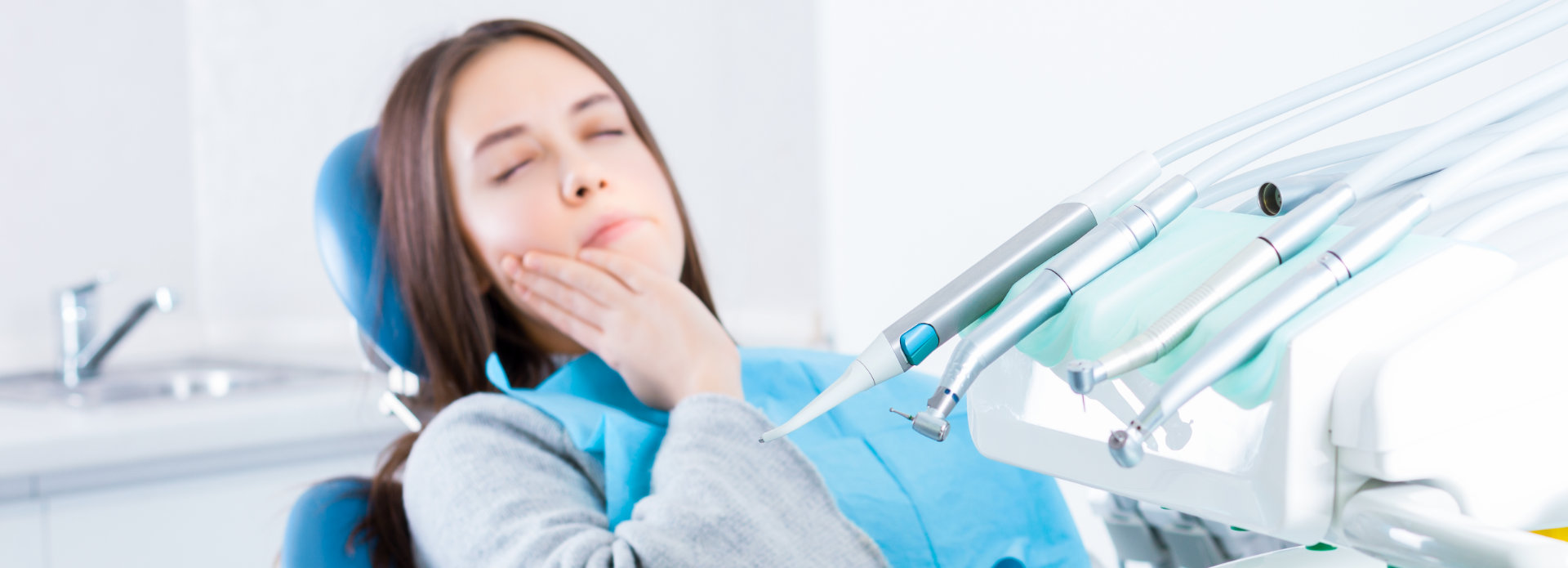 Woman with dental pain during the same day dental appointment in Marietta, GA
