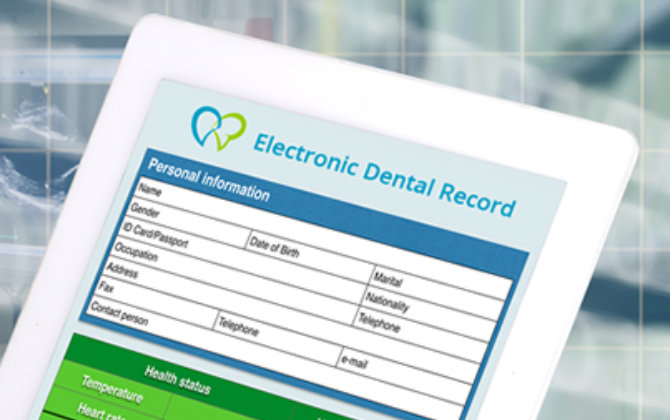 An electronic dental record is displayed on a tablet.