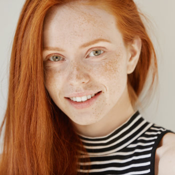 smiling red-haired teenage girl