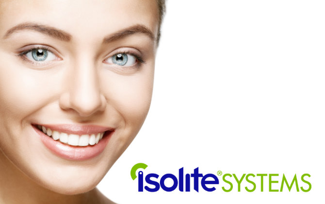 A woman smiles with the logo of isolite systems.
