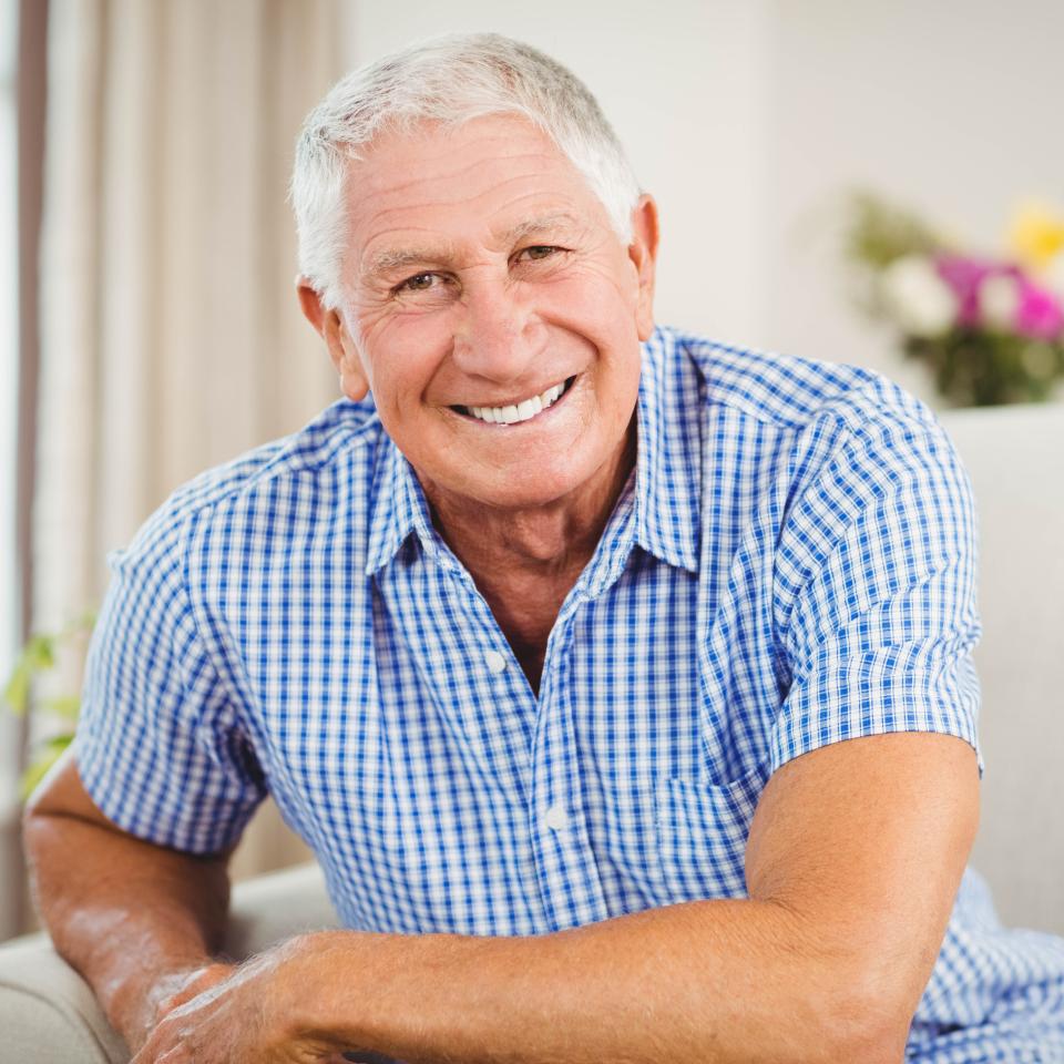 Senior man looking at camera and smiling