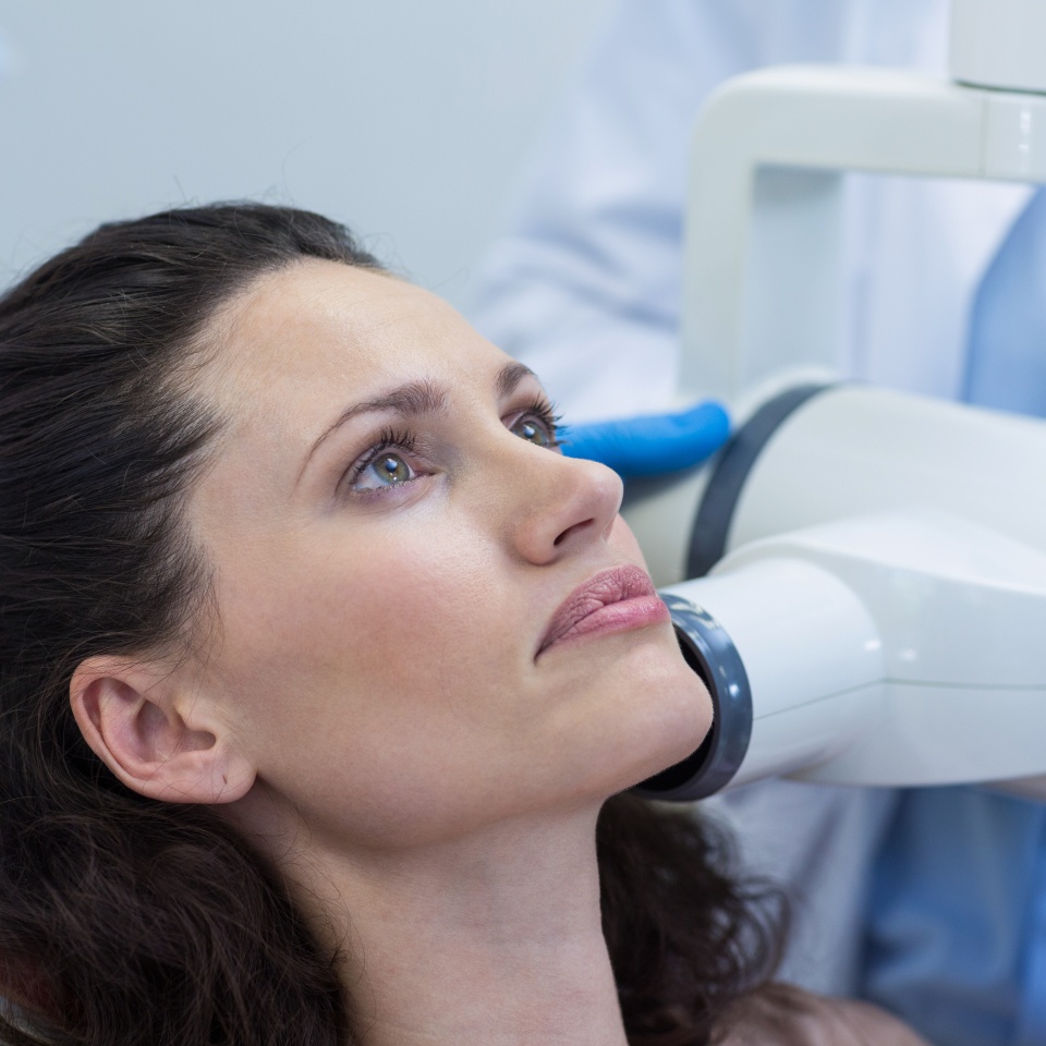 Dentist taking x-ray of patients teeth at dental clinic
