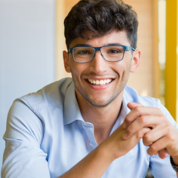 Young man wearing glasses Marietta Dental Professionals patient care