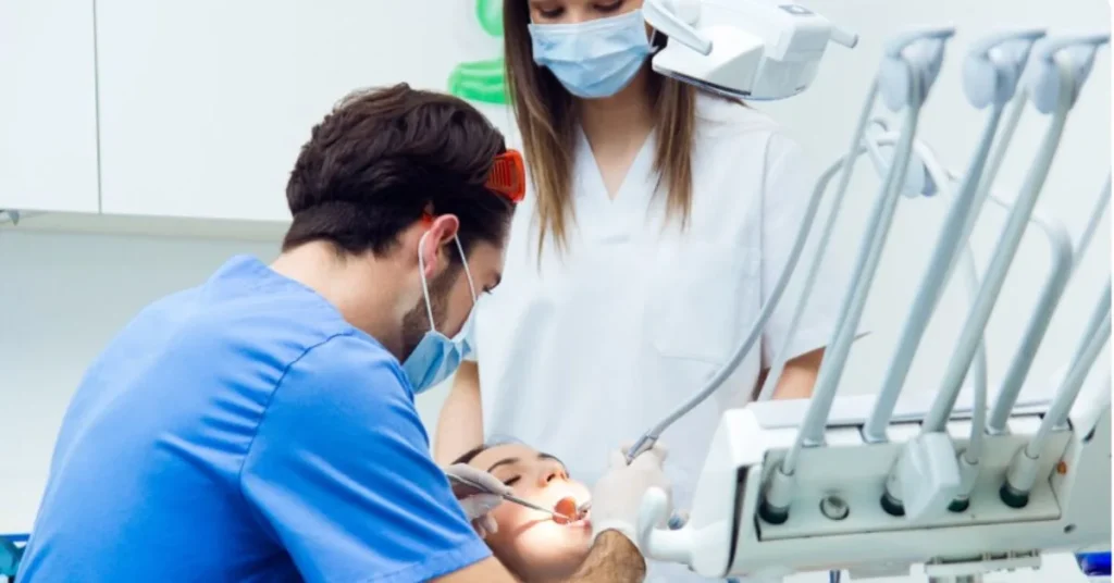 Dentist treating patient in modern clinic for cosmetic dentistry Marietta