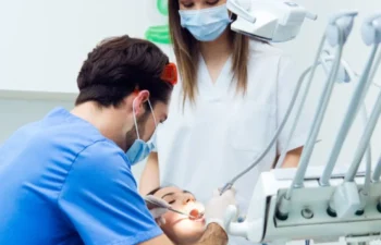 Dentist treating patient in modern clinic for cosmetic dentistry Marietta