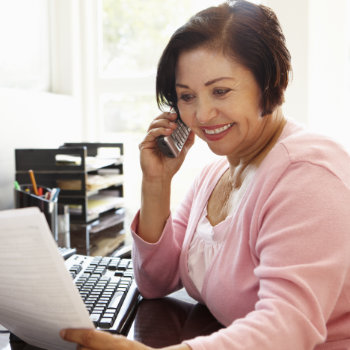 Senior Hispanic woman receptionist at Marietta Dental Professionals