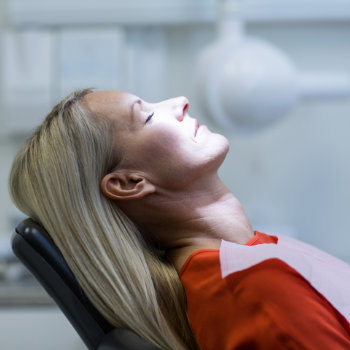 Woman relaxing on dentist chair Marietta Dental Professionals care