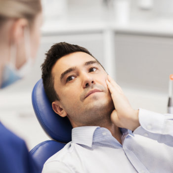 Tooth Pain Relief man in dental chair Emergency Dental Care  Marietta