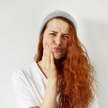 Redhead girl tooth pain Emergency Dental Care in   Marietta image