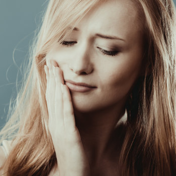Emergency Dental Care in   Marietta woman with tooth pain discomfort