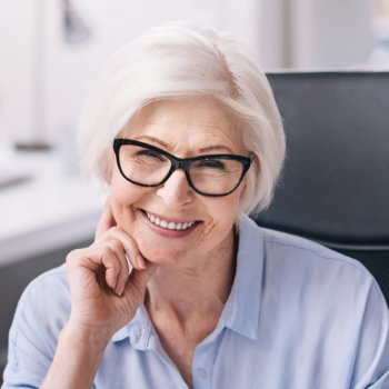 Smiling senior woman with glasses Marietta Dental Professionals care