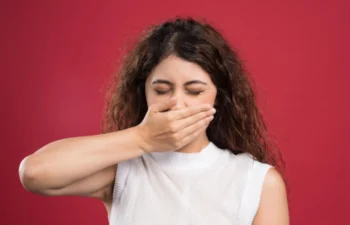 Young woman reacting to dry mouth bad breath and oral dryness