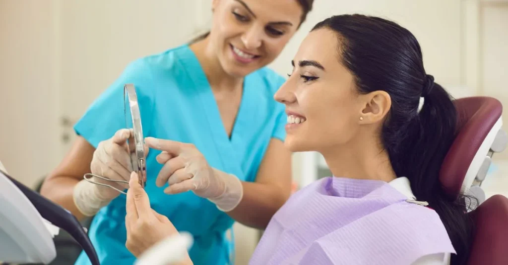 Patient reviews smile results with dentist in Marietta GA